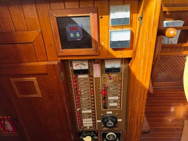 Slide: The Image of Control panel of 1983 DeFever 41 Trawler with gauges and switches. - 39