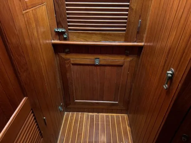 Slide: The Image of Wooden interior of 1983 DeFever 41 Trawler, featuring rich paneling and classic design. - 49