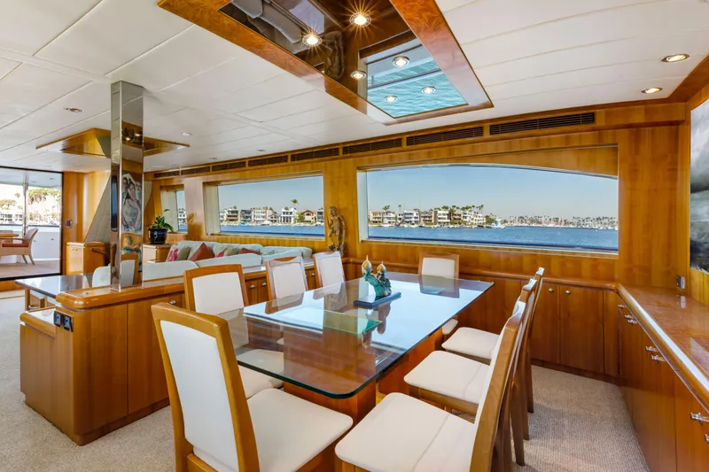 Slide: The Image of Luxurious 2005 Horizon Custom Yacht interior with elegant dining area and panoramic windows. - 34