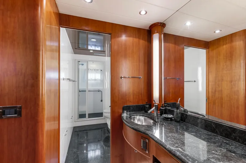 Slide: The Image of Luxurious bathroom in 2005 Horizon Custom Yacht with wood paneling and modern fixtures. - 47