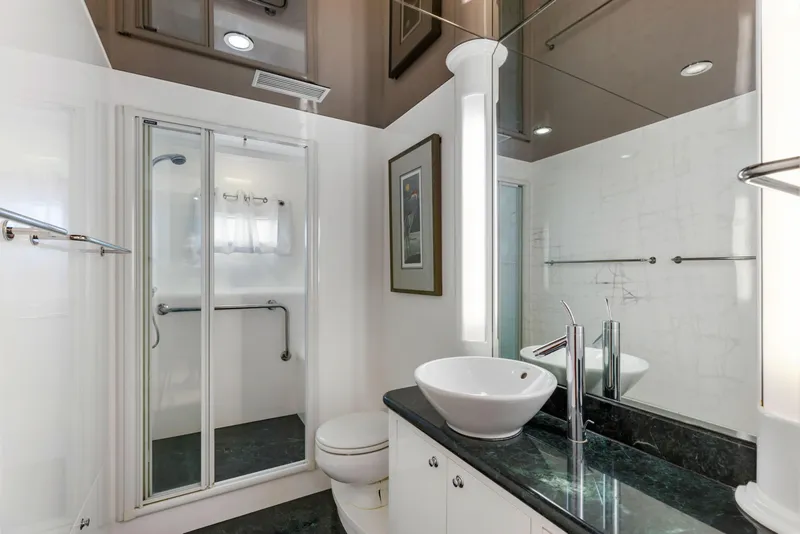 Slide: The Image of Luxurious bathroom in 2005 Horizon Custom Yacht with modern fixtures and elegant design. - 48