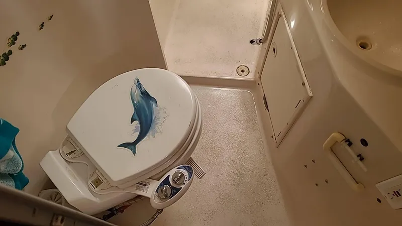 Slide: The Image of Boat bathroom with dolphin-themed toilet seat, PDQ 36, 1999 model. - 17