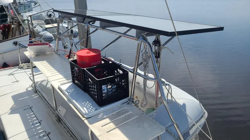 Slide: The Image of PDQ 36 sailboat deck with solar panel and storage crate, 1999 model. - 6