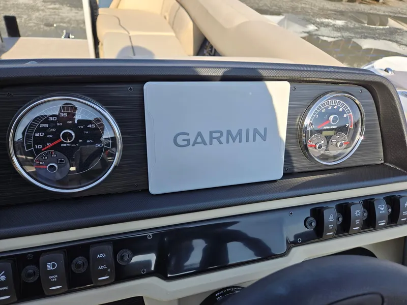 Slide: The Image of Dashboard of 2025 Godfrey Sweetwater 2086 C with Garmin display and gauges. - 15