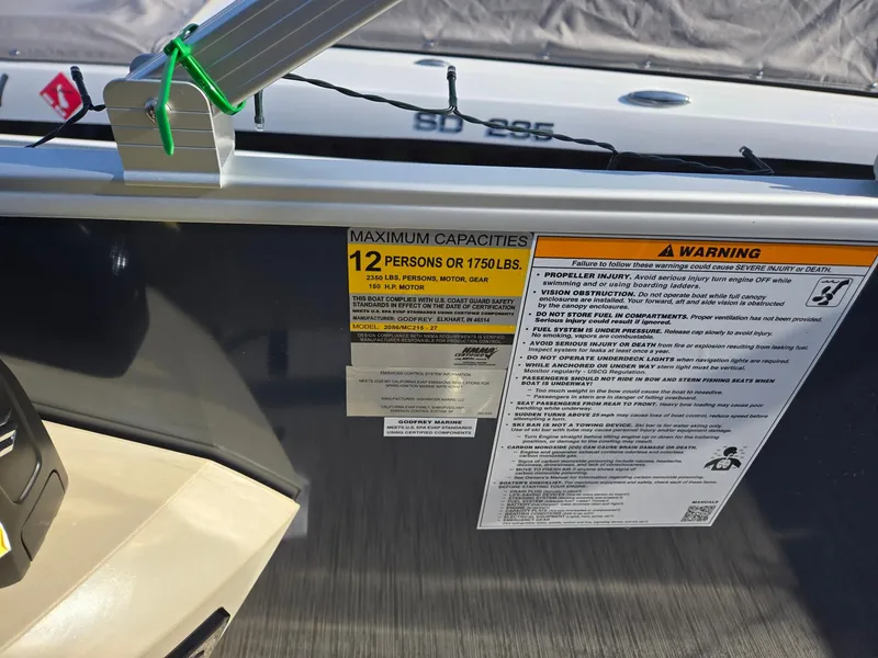 Slide: The Image of 2025 Godfrey Sweetwater 2086 C capacity warning label, maximum 12 persons or 1750 lbs. - 19