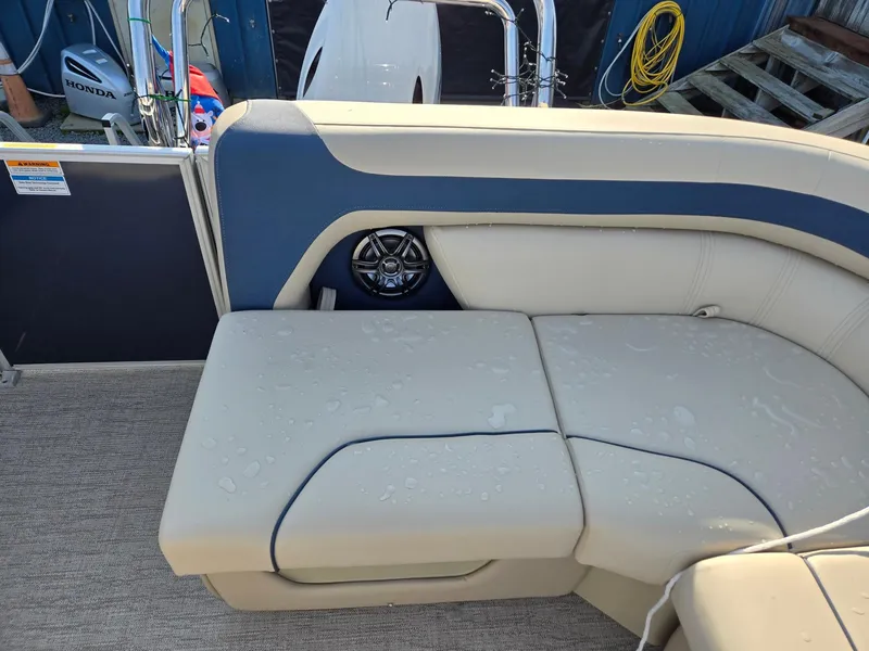 Slide: The Image of 2025 Godfrey Sweetwater 2086 C boat interior with beige and blue seating. - 21
