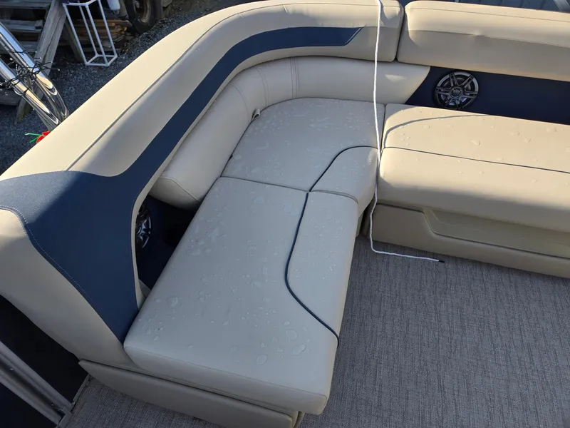 Slide: The Image of 2025 Godfrey Sweetwater 2086 C boat seating with beige and navy upholstery. - 23