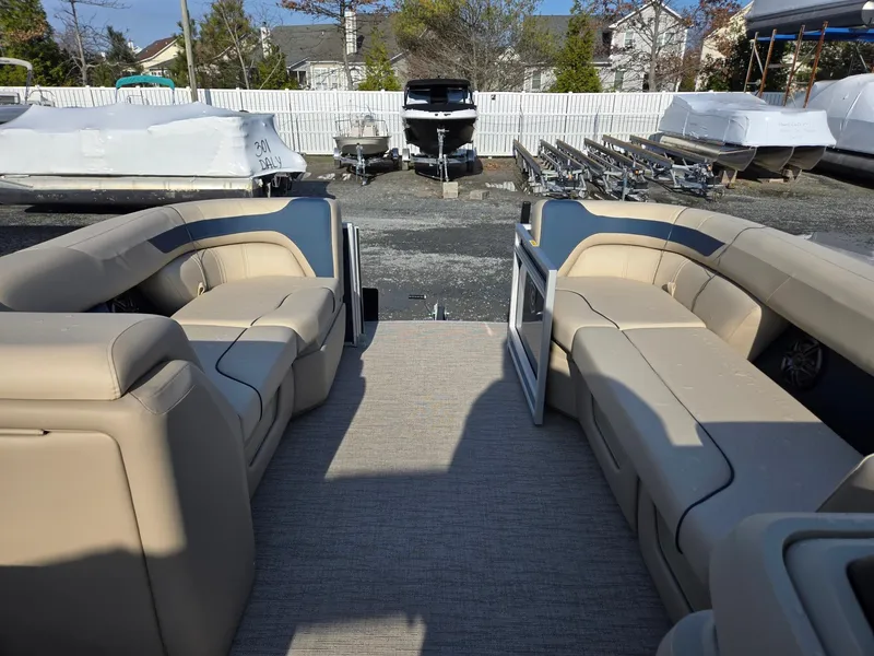 Slide: The Image of 2025 Godfrey Sweetwater 2086 C pontoon boat interior with beige seating. - 27