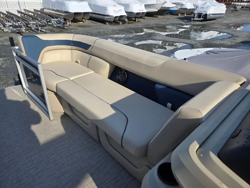 Slide: The Image of 2025 Godfrey Sweetwater 2086 C pontoon boat with beige seating and spacious deck. - 28