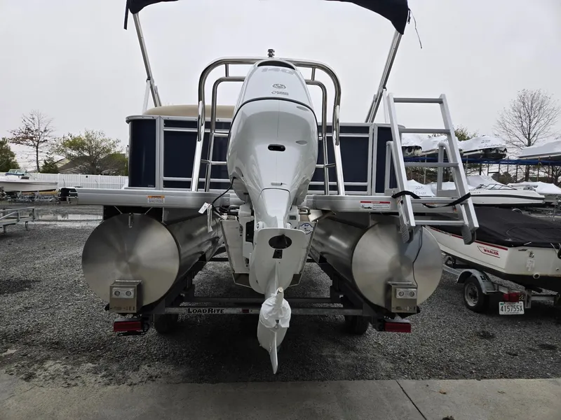 Slide: The Image of 2025 Godfrey Sweetwater 2086 C pontoon boat, rear view with motor and ladder. - 3
