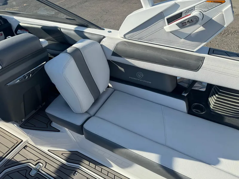 Slide: The Image of 2017 Nautique G25 boat interior with sleek seating and modern design. - 10