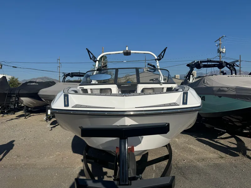 Slide: The Image of 2017 Nautique G25 boat on trailer, front view, sunny day. - 4