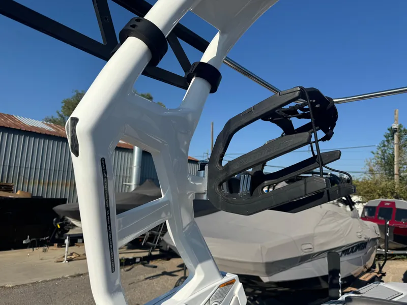 Slide: The Image of 2017 Nautique G25 wakeboard tower with rack in a boatyard setting. - 5