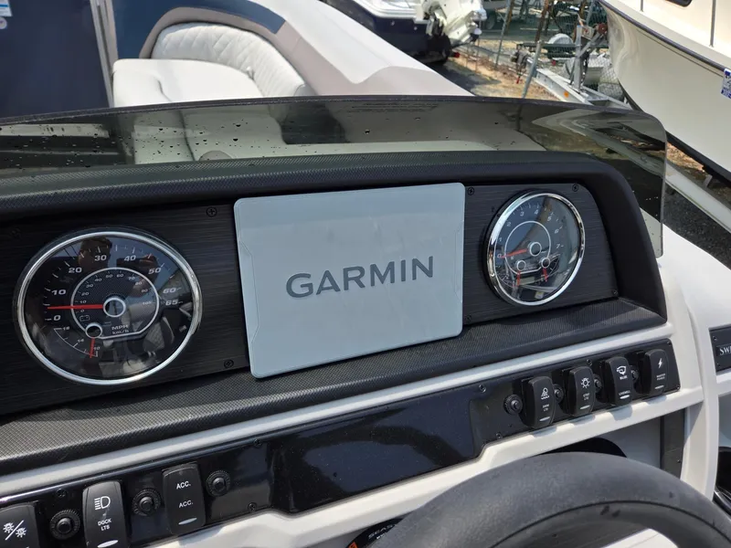 Slide: The Image of Dashboard of 2025 Godfrey SWEETWATER 2286 SFL with Garmin display and gauges. - 14