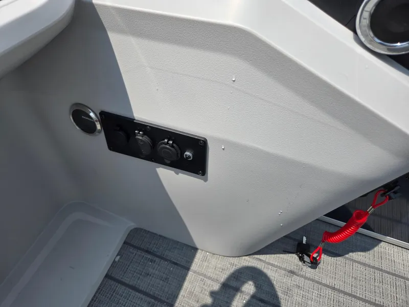 Slide: The Image of Control panel on 2025 Godfrey SWEETWATER 2286 SFL boat with red safety cord. - 17