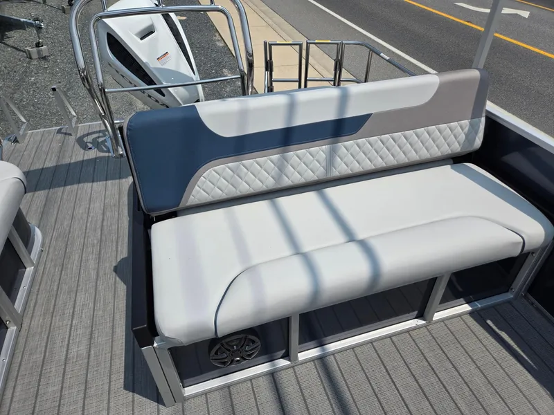 Slide: The Image of 2025 Godfrey SWEETWATER 2286 SFL boat interior with cushioned seating and modern design. - 20