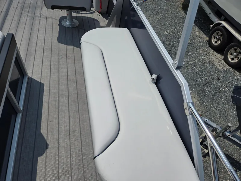 Slide: The Image of 2025 Godfrey SWEETWATER 2286 SFL boat interior with sleek seating and modern design. - 24