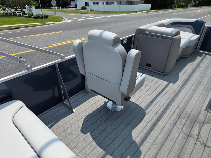 Slide: The Image of 2025 Godfrey SWEETWATER 2286 SFL pontoon boat interior with plush seating and sleek design. - 26