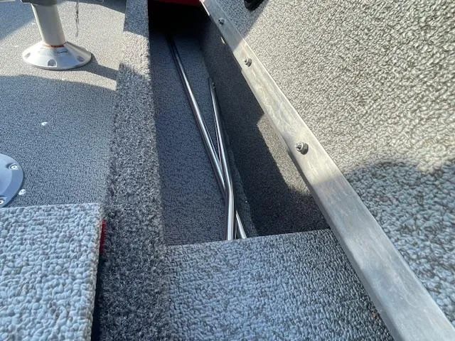 Slide: The Image of 2025 Lund 1650 Angler SS interior with rod storage compartment. - 14