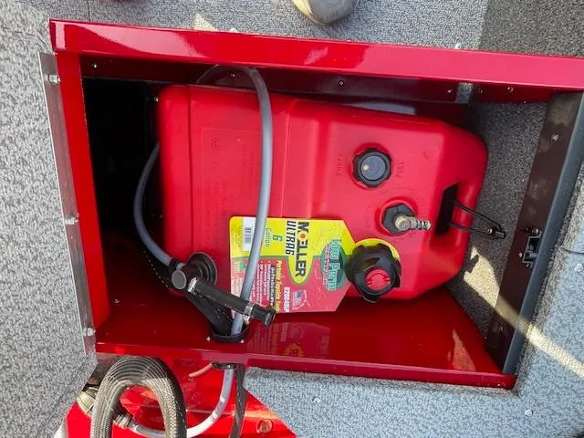 Slide: The Image of Red fuel tank in 2025 Lund 1650 Angler SS boat compartment. - 15