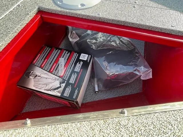 Slide: The Image of Storage compartment in 2025 Lund 1650 Angler SS boat with packaged items. - 17
