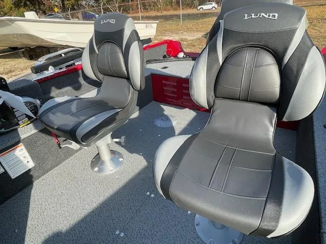 Slide: The Image of 2025 Lund 1650 Angler SS boat seats, gray and black design, outdoor setting. - 9