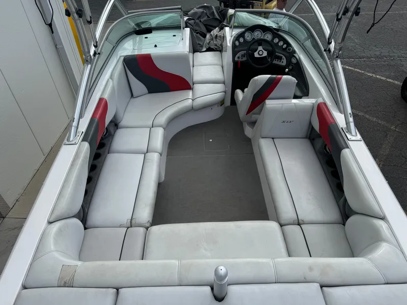Slide: The Image of 2006 Moomba XLV boat interior with spacious seating and modern dashboard. - 6