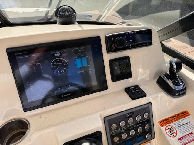 Slide: The Image of Control panel of 2018 Scout 275 Dorado boat with navigation and control systems. - 13
