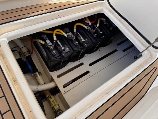 Slide: The Image of Battery compartment of a 2018 Scout 275 Dorado boat, featuring multiple connected batteries. - 15
