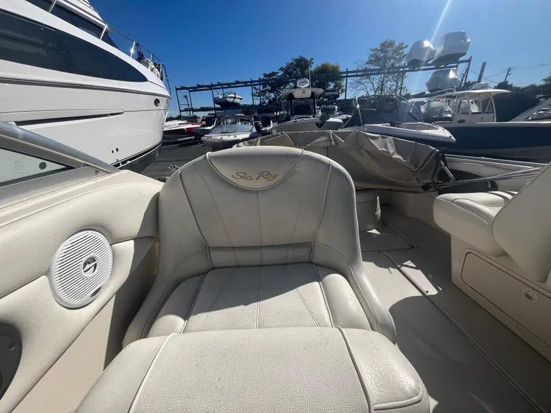 Slide: The Image of 2001 Sea Ray 245 Weekender boat interior with white leather seating. - 10