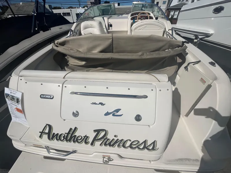 Slide: The Image of 2001 Sea Ray 245 Weekender boat named "Another Princess" at a marina. - 5
