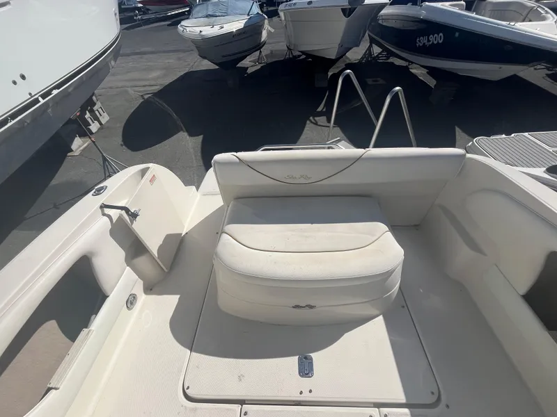 Slide: The Image of 2001 Sea Ray 245 Weekender boat interior with seating and storage area. - 6