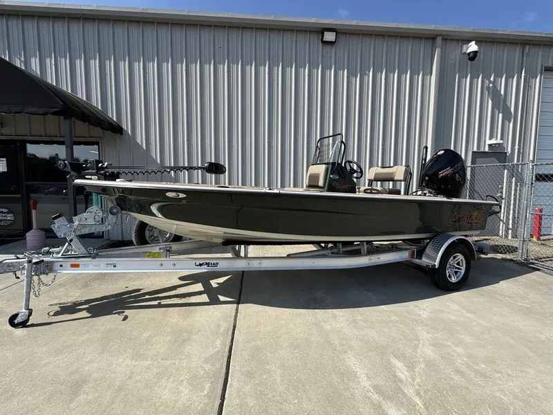The Image of 2025 Mako Pro Skiff 18 Backwater Edition on trailer outside a metal building. - 1