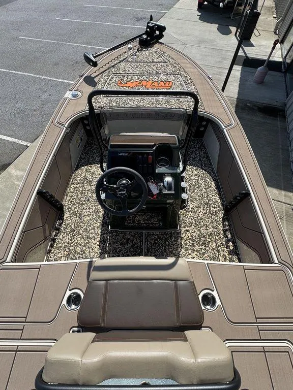 Slide: The Image of 2025 Mako Pro Skiff 18 Backwater Edition with camouflage interior and steering console. - 11