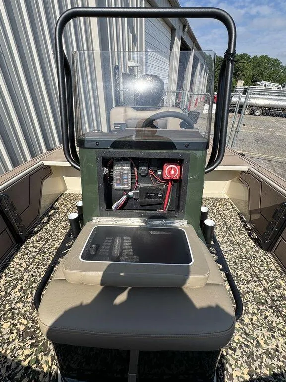 Slide: The Image of 2025 Mako Pro Skiff 18 Backwater Edition boat interior with control panel and seating. - 13