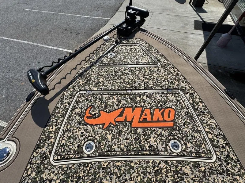 Slide: The Image of 2025 Mako Pro Skiff 18 Backwater Edition with camo deck and trolling motor. - 14