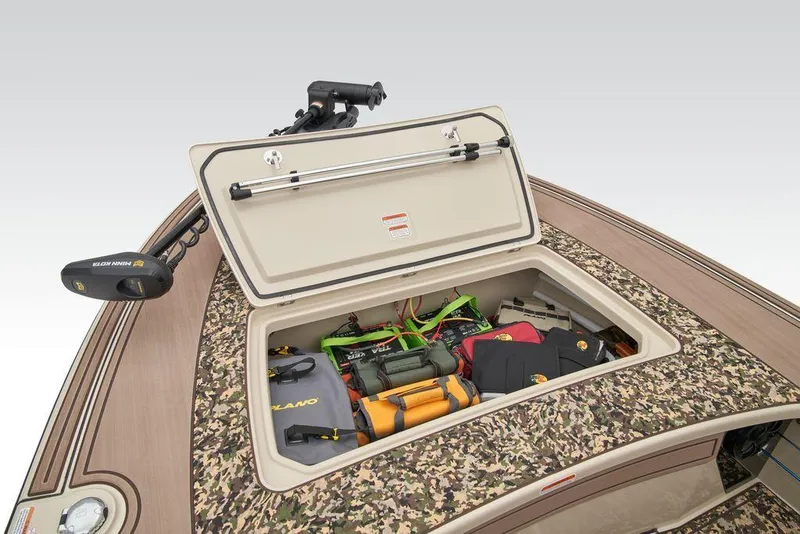 Slide: The Image of 2025 Mako Pro Skiff 18 Backwater Edition storage compartment with fishing gear and accessories. - 35