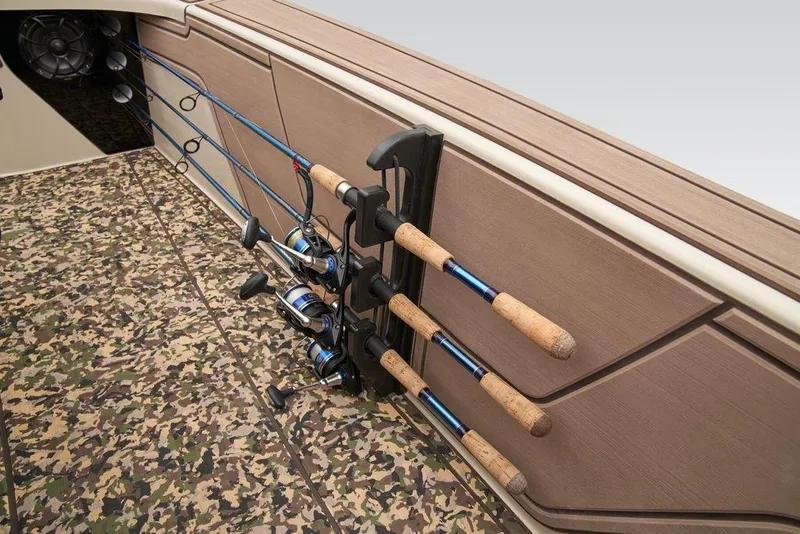 Slide: The Image of Fishing rods secured on Mako Pro Skiff 18 Backwater Edition 2025 boat with camo flooring. - 43