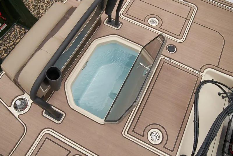 Slide: The Image of 2025 Mako Pro Skiff 18 Backwater Edition deck with open storage compartment. - 47