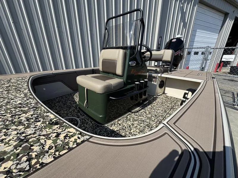 Slide: The Image of 2025 Mako Pro Skiff 18 Backwater Edition with camouflage deck and dual seating. - 7