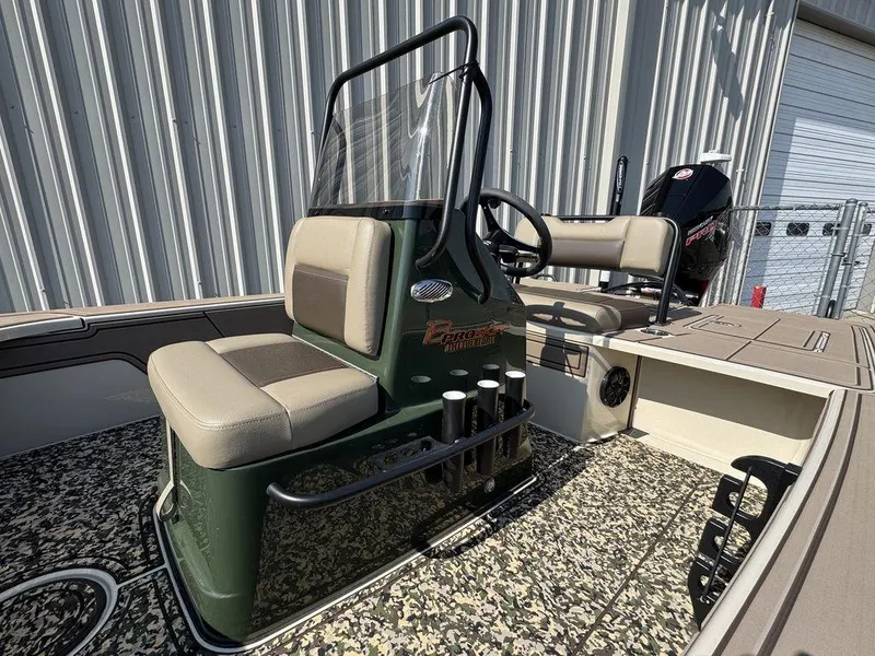 Slide: The Image of 2025 Mako Pro Skiff 18 Backwater Edition boat with seating and steering console. - 8