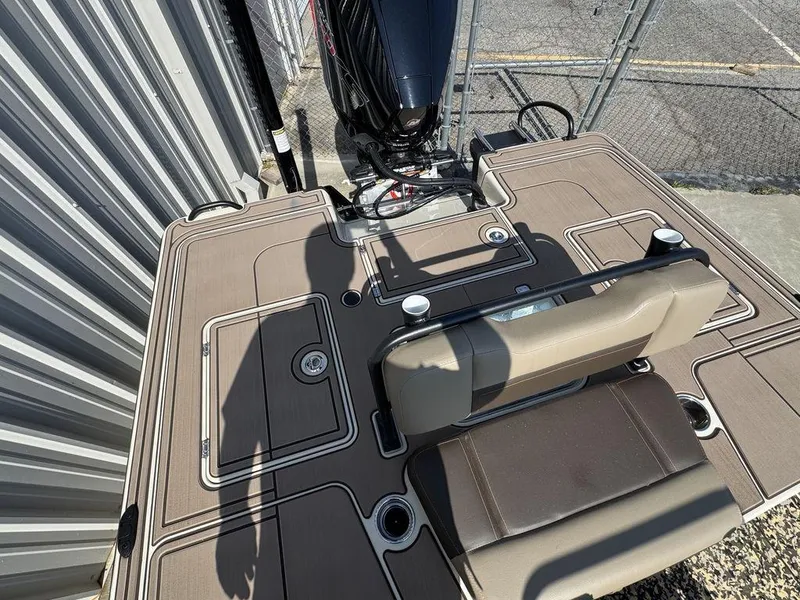 Slide: The Image of 2025 Mako Pro Skiff 18 Backwater Edition boat deck with seating and motor. - 9