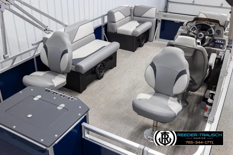 Slide: The Image of Interior of 2025 Avalon VEN RF pontoon boat with gray seating and steering console. - 12