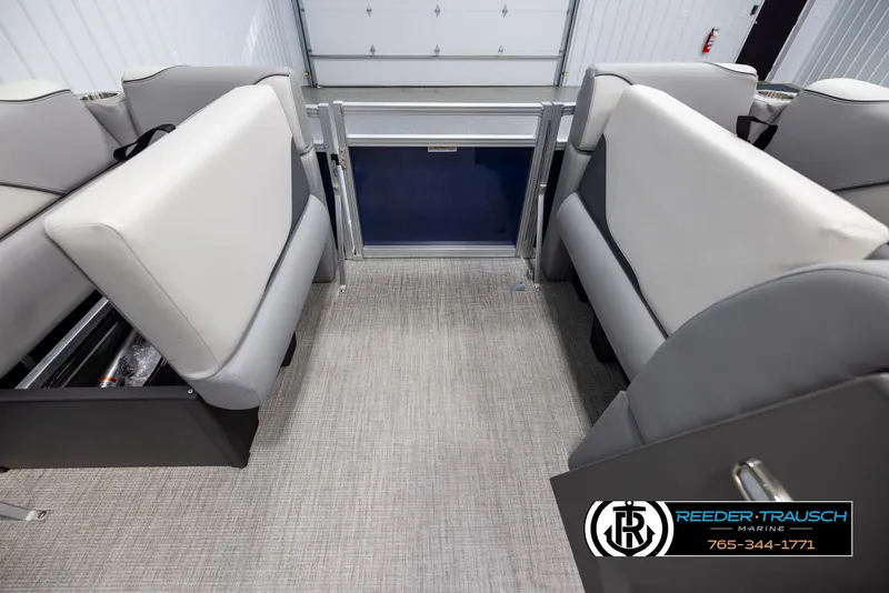 Slide: The Image of Interior of 2025 Avalon VEN RF boat with gray seating and carpet flooring. - 19