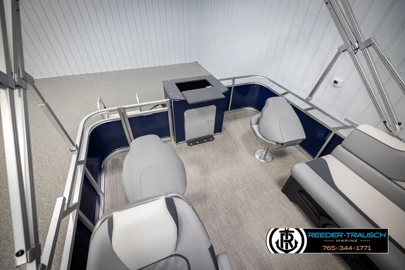 Slide: The Image of Interior of 2025 Avalon VEN RF boat with seating and console, showcased by Reeder Trausch Marine. - 23