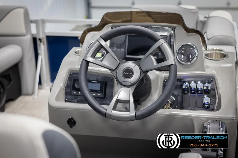 Slide: The Image of Steering console of 2025 Avalon VEN RF boat with modern controls and dashboard. - 24