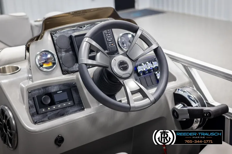 Slide: The Image of Steering console of 2025 Avalon VEN RF boat with modern controls and dashboard. - 25