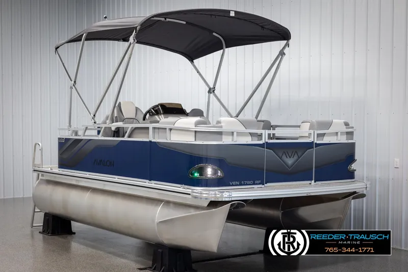 Slide: The Image of 2025 Avalon VEN RF pontoon boat with canopy in showroom display. - 3