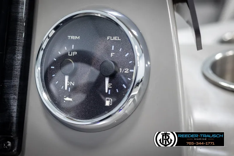 Slide: The Image of Close-up of Avalon VEN RF 2025 dashboard gauge showing trim and fuel levels. - 30