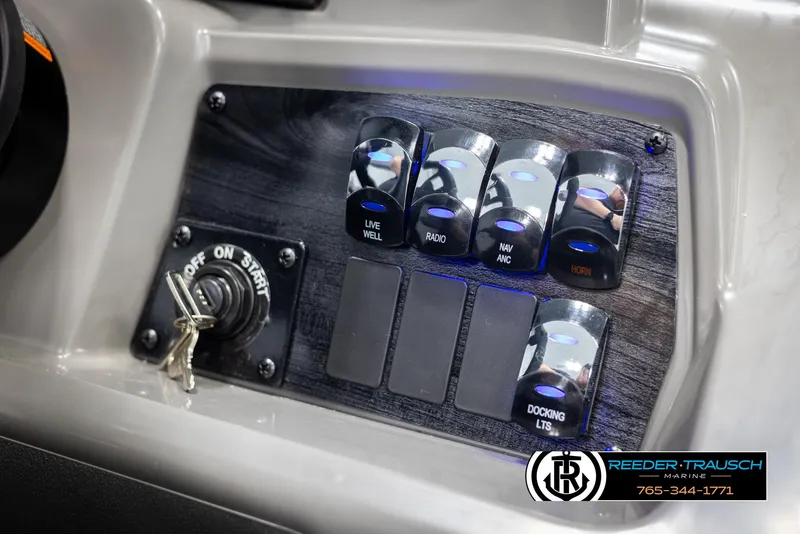 Slide: The Image of Control panel of 2025 Avalon VEN RF boat with switches and ignition key. - 31